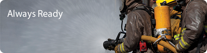 Always Ready Banner with picture of firemen holding hose with water coming out.