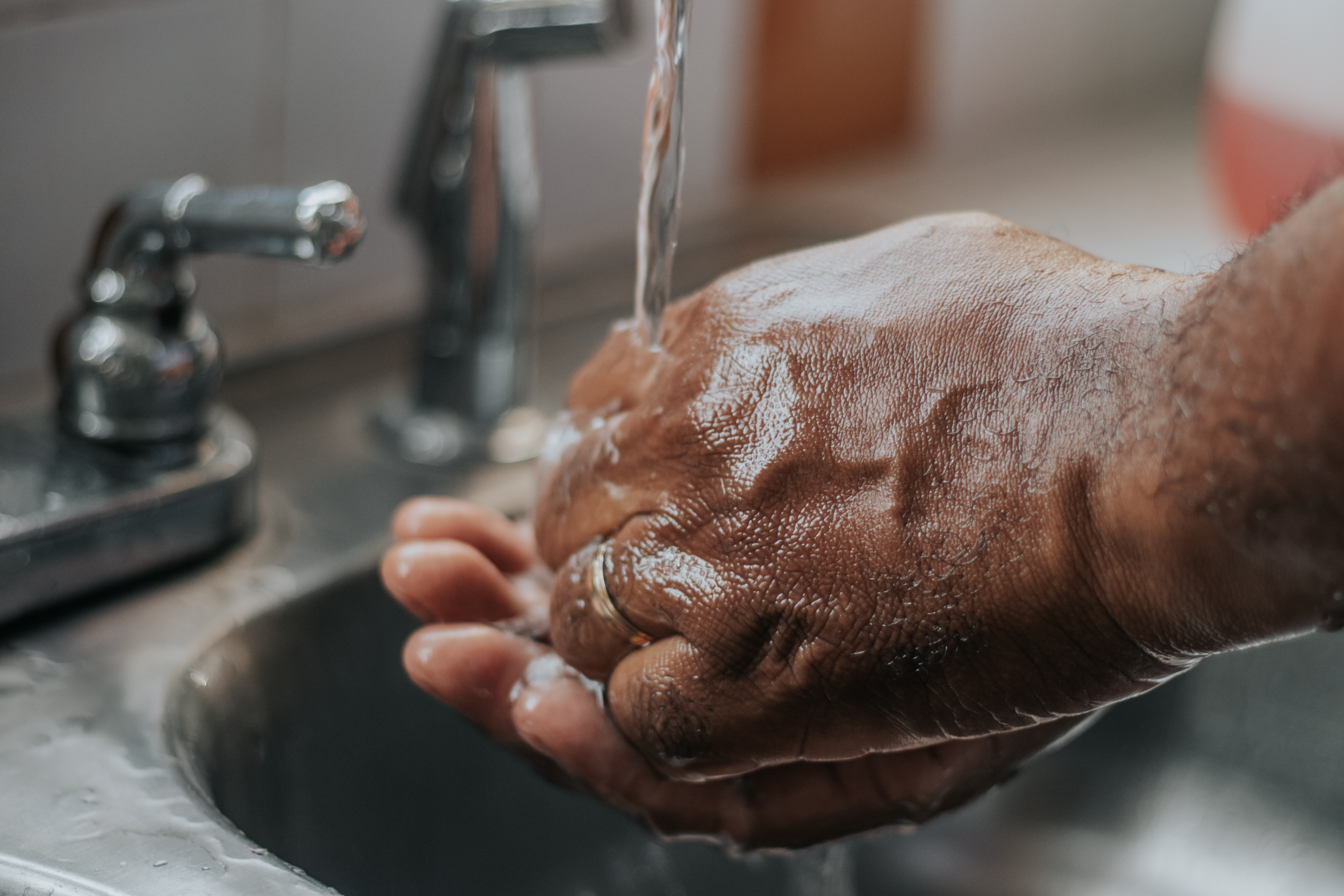 washing hands in sink